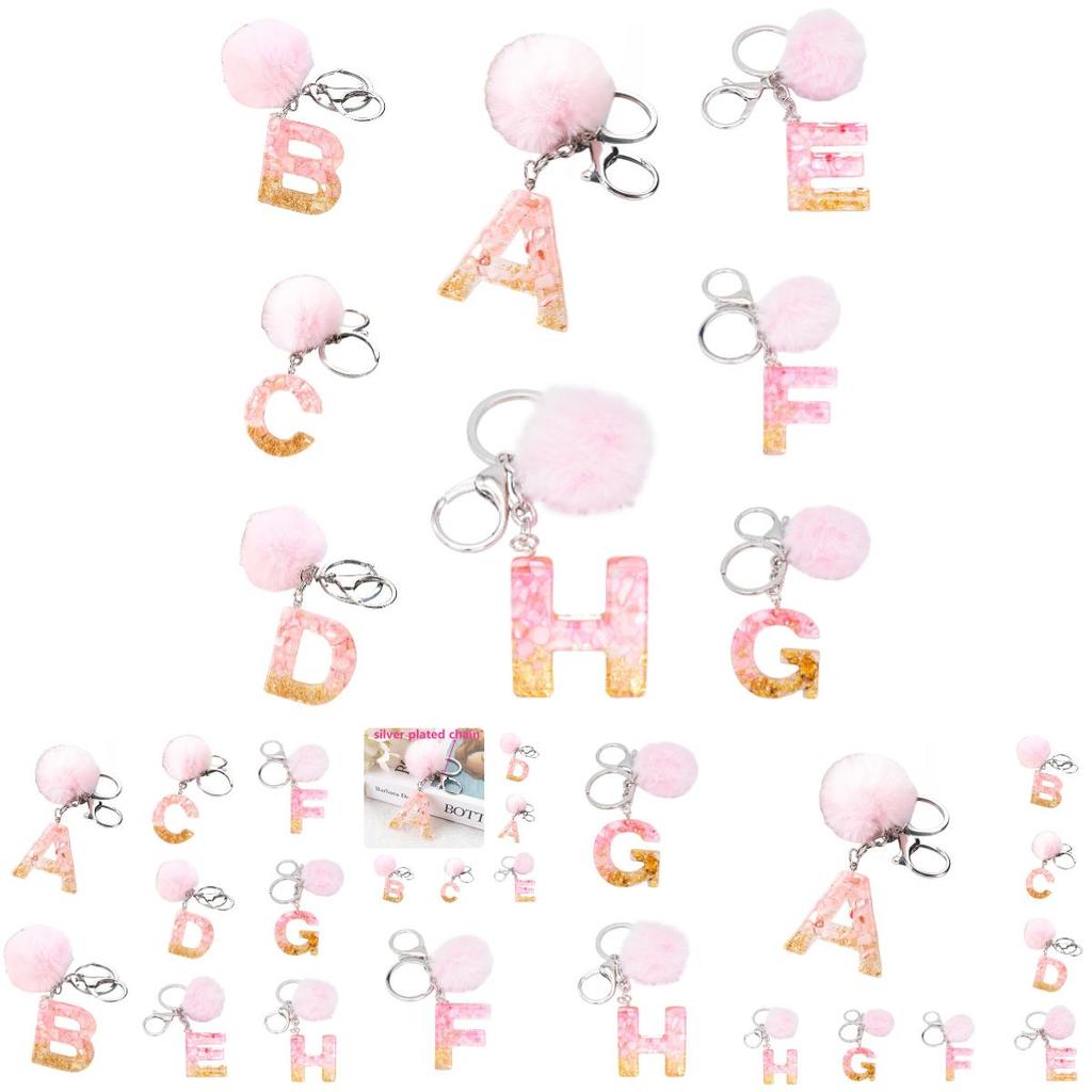 Modischer Schlüsselanhänger mit Plüschball und englischen Buchstaben Kreatives Autozubehör