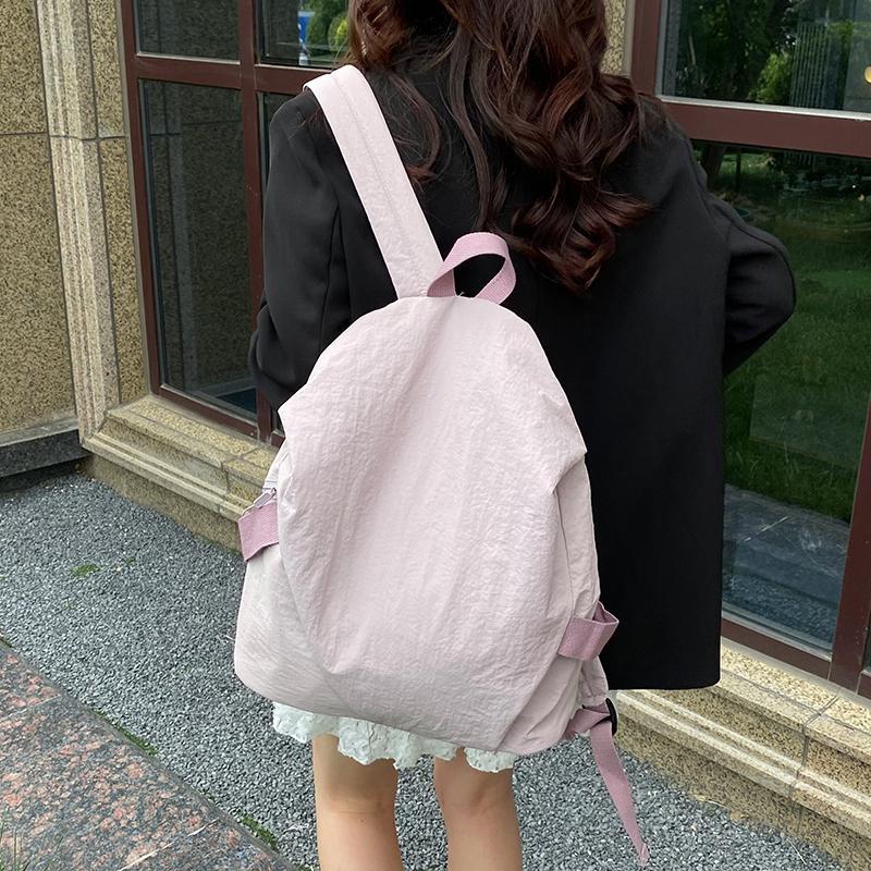 Schoolbag High-value backpack Women's simple solid color casual versatile backpack Light commuter travel bag Male college student schoolbag