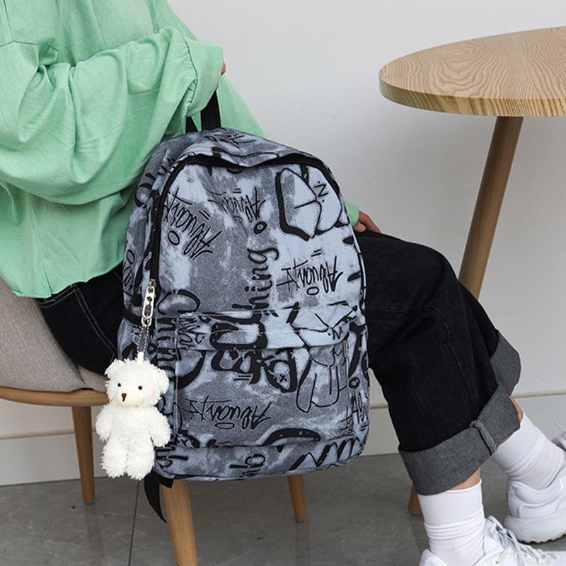 Nouveau Sac à Dos Scolaire Couple Lettres Graffiti Mode Loisirs Voyage Multifonctionnel