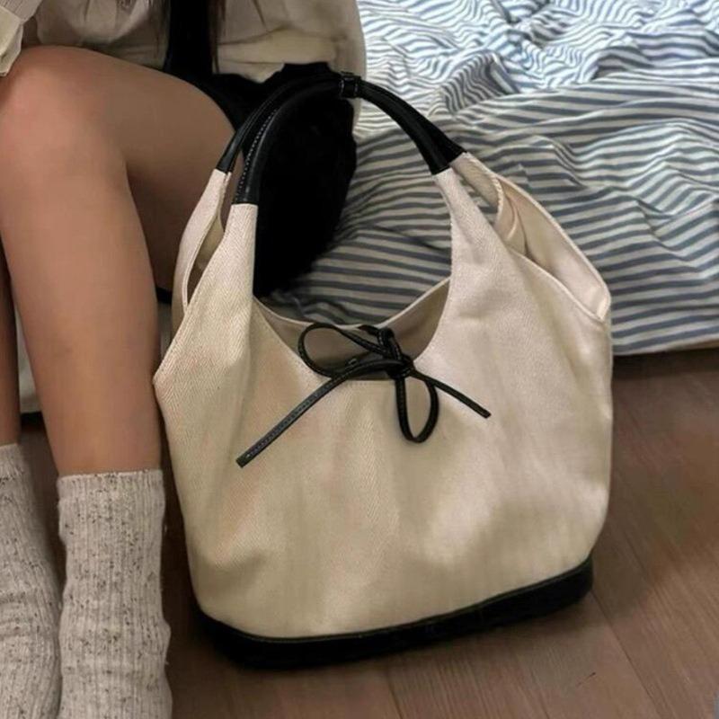 Nischen-Retro-Umhängetasche aus Canvas für Damen, neue einfache kleine Arbeitstasche, Unterarm-Pendeltasche