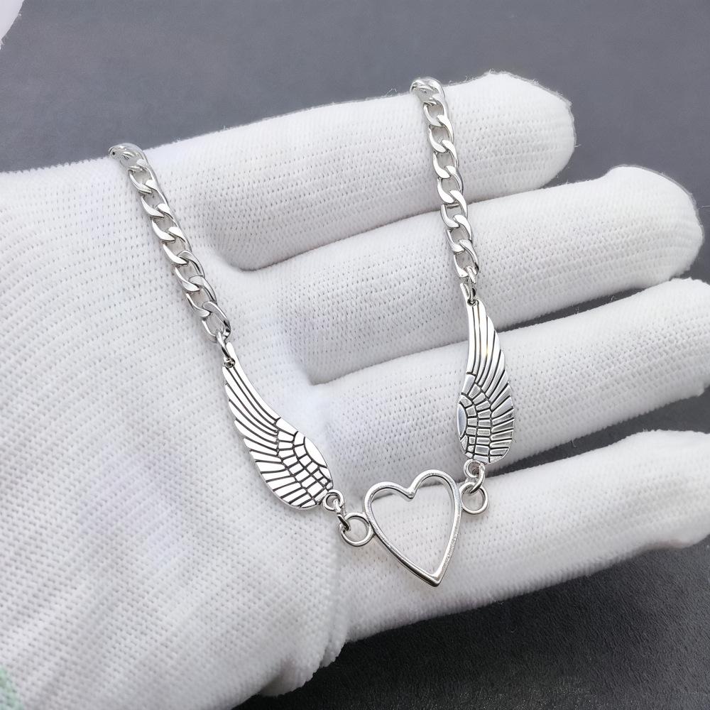 Engelsflügel-Herz-Anhänger-Halskette: Vielseitiges Legierungsfeder-Design für Männer & Frauen