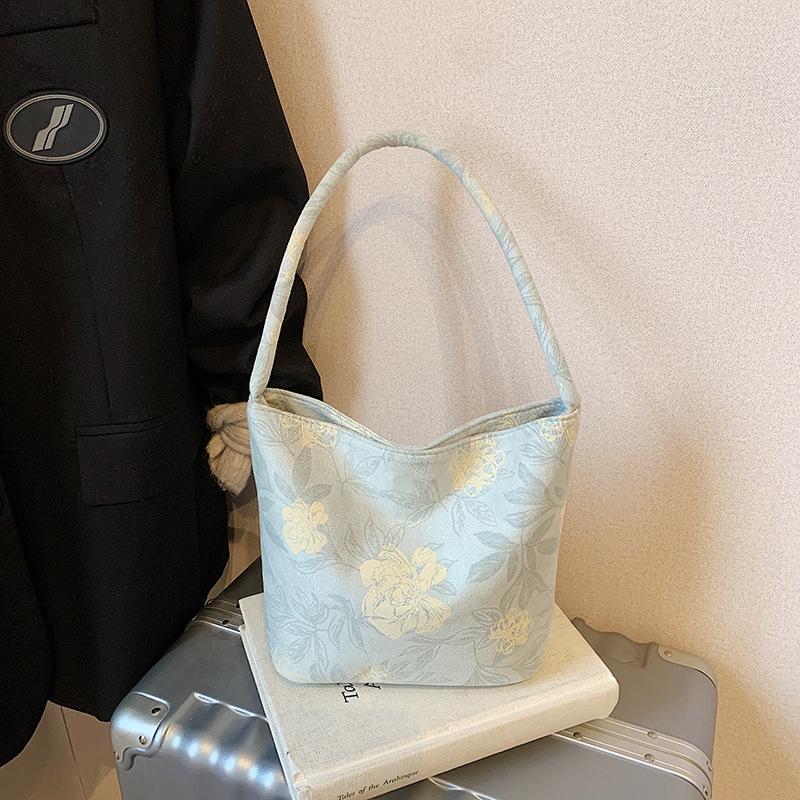 Fashion trend niche design bucket bag 2025 summer new casual texture women's shoulder messenger bag