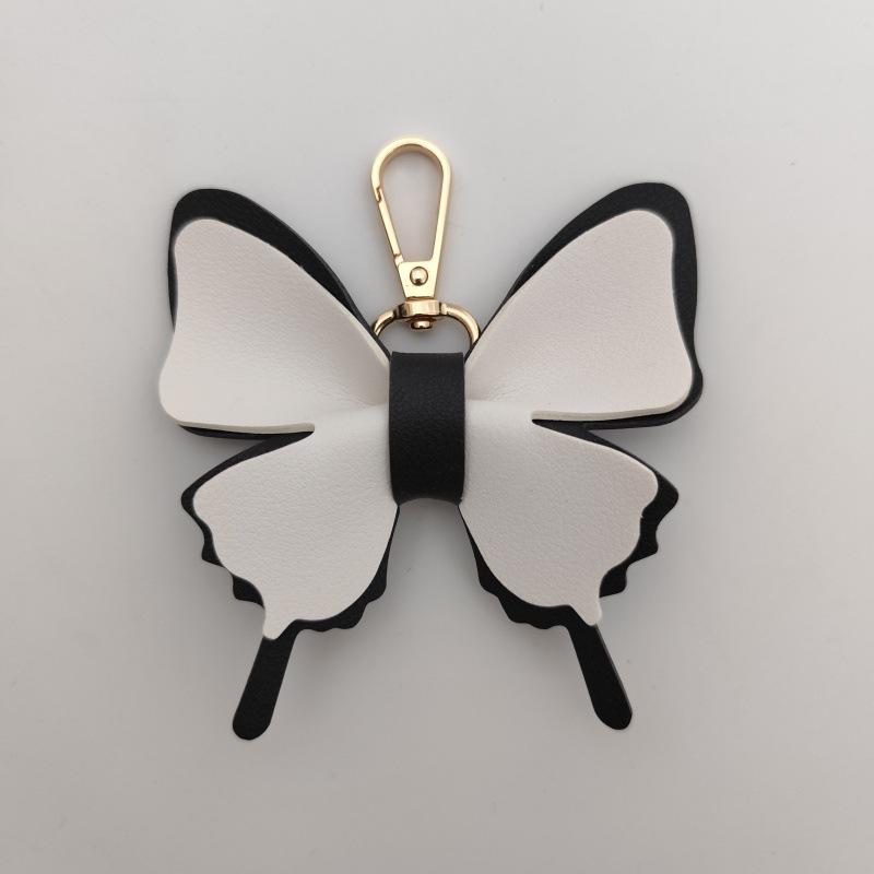 

Butterfly Charms: Macaron Color Leather Keychain Pendants чорний/білий