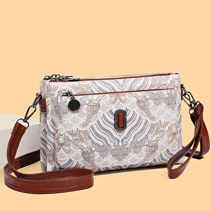 

Элегантная новая китайская маленькая квадратная сумка - Универсальная, модная на плечо и через плечо из мягкой кожи