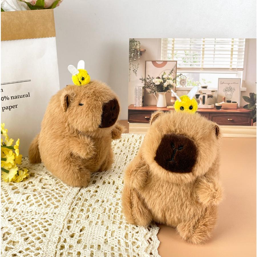 

Creative Cute Wagging Tail Bee Kapibala Plush Doll Pull Rope Capybar Toy Bag Pendant Doll about 12cm high