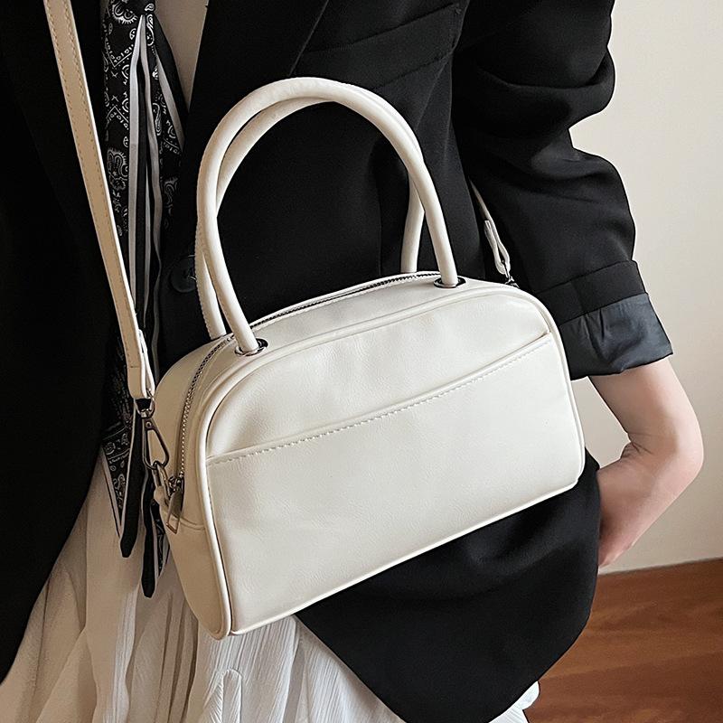 Spring and summer new Korean version niche solid color texture portable pillow bag fashionable commuter style versatile casual messenger women's bag