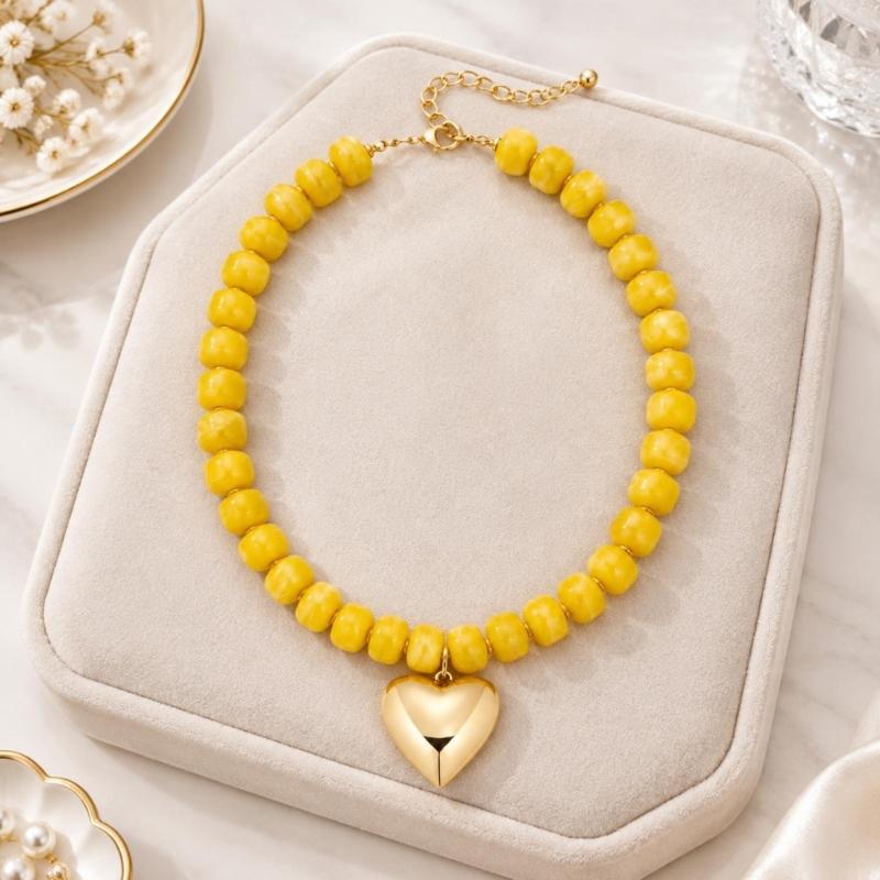 Adjustable Beaded Pendant Necklace with Rounded Resin Beads, Heart-Shaped Center Pendant, Extension Chain, and Lobster Clasp