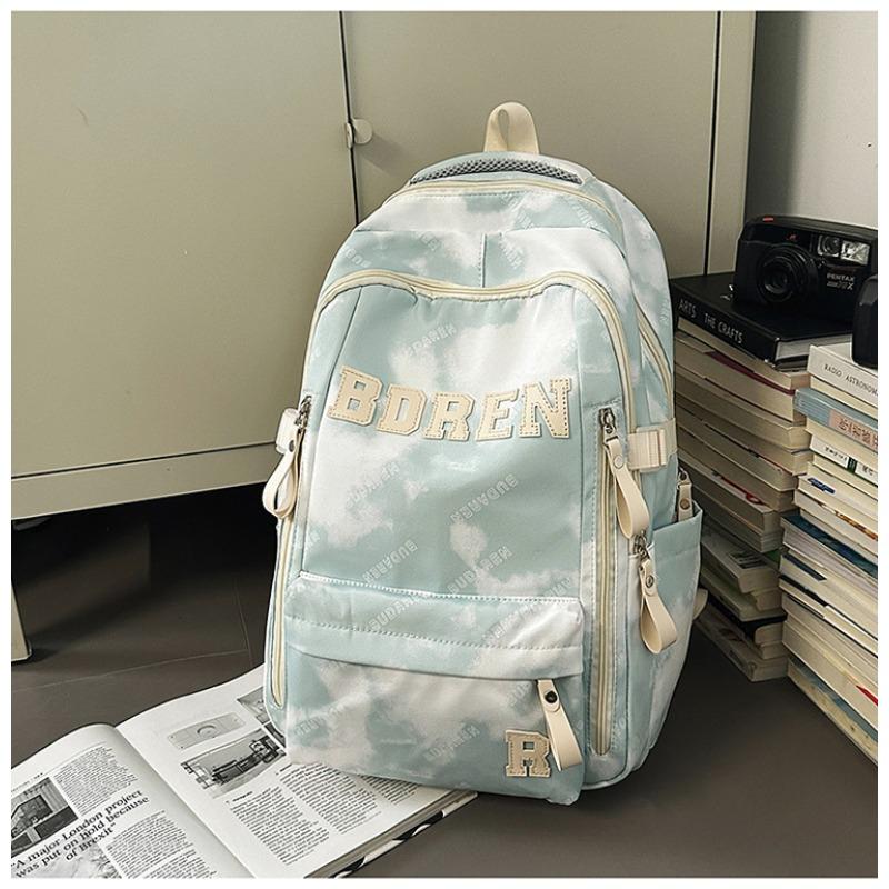The new schoolbag is high-value, fresh and sweet, literary tie-dye backpack, couple contrasting colors, light travel backpack.