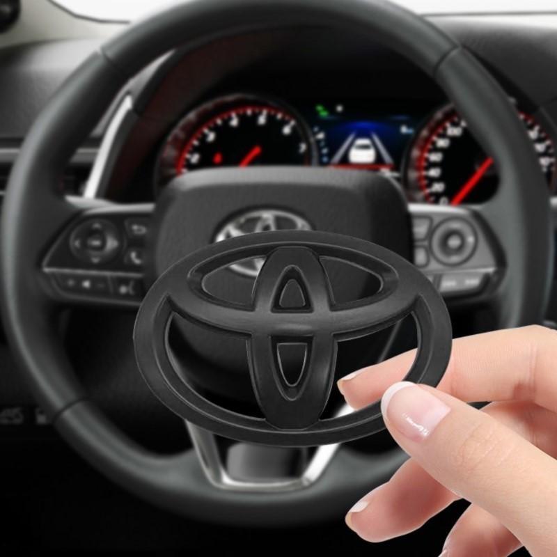 65X47MM Car Steering Wheel Center Emblem Logo Sticker For Toyota Corolla Yaris Aygo Prius RAV4 Crown CHR Camry Auris Verso