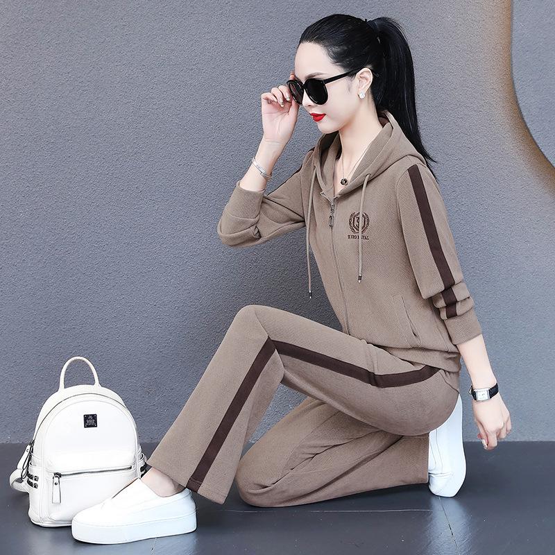 Trendiges Damen-Zweiteiler-Set mit weiten Hosen & Kapuzenpullover - Herbst 2023 Modische Freizeit-Sportbekleidung.