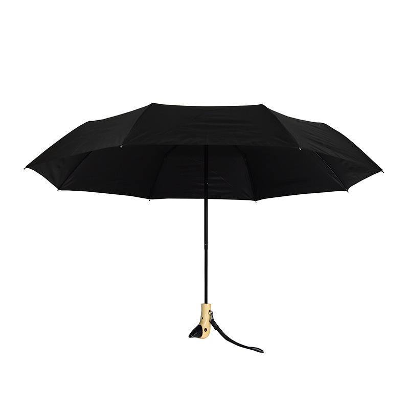 Cute Three-Fold Duck Head Umbrella: Cartoon Design, Wooden Handle, Solid Color for Rain or Shine.