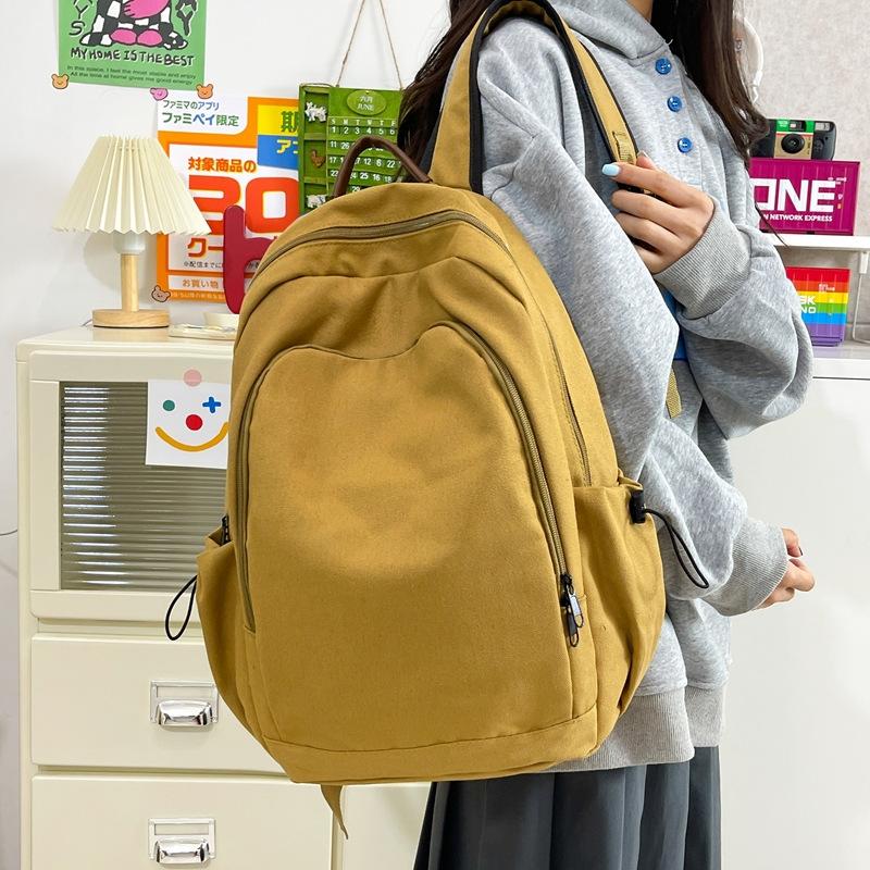 Schoolbag Solid color canvas backpack female Harajuku simple large capacity high school college student schoolbag Mori travel texture backpack