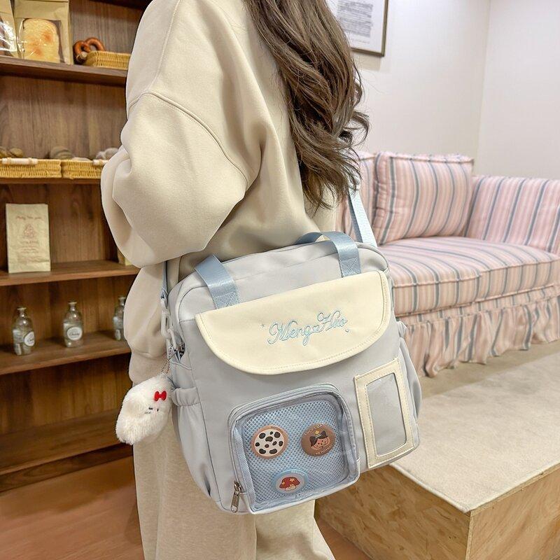 Japanische Schmerzbeutel Umhängetasche Damen Neue modische große Kapazität tragbare Tragetasche vielseitige Studenten-Schultertasche Trend