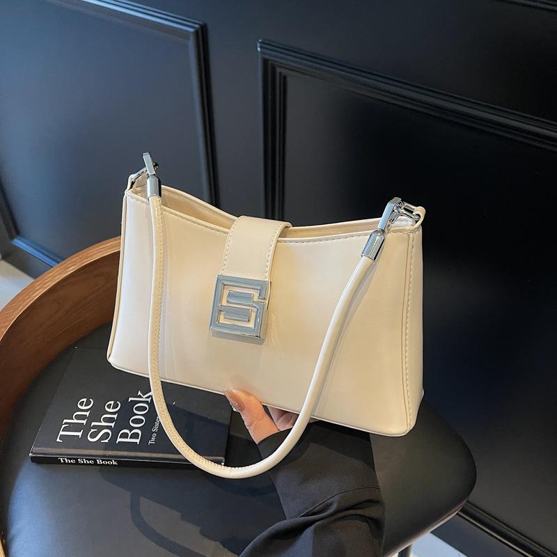 Korean version of versatile bag women's 2025 spring and summer retro fashion baguette bag niche high-end commuter casual messenger bag