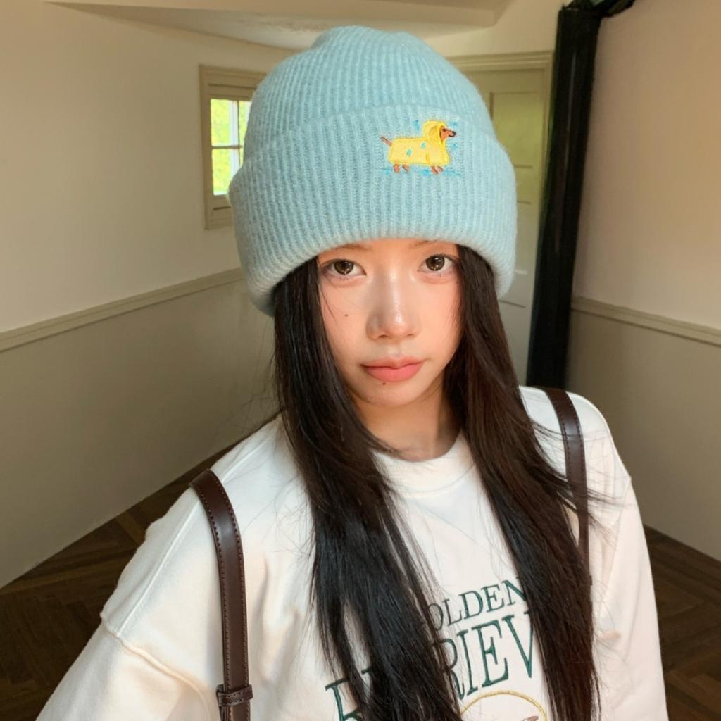 Embroidered Woolen Caps Are Cute for Children In Autumn and Winter. They Are Small Knitted Caps with Big Heads That Show Off Their Faces