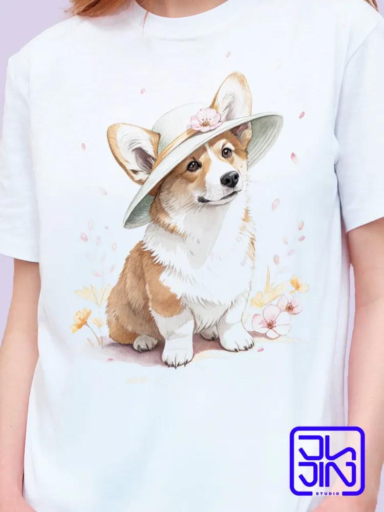 women's T-shirt with a signature print featuring a cheerful red corgi dog in a distinctive brown hat with flowers. White cott