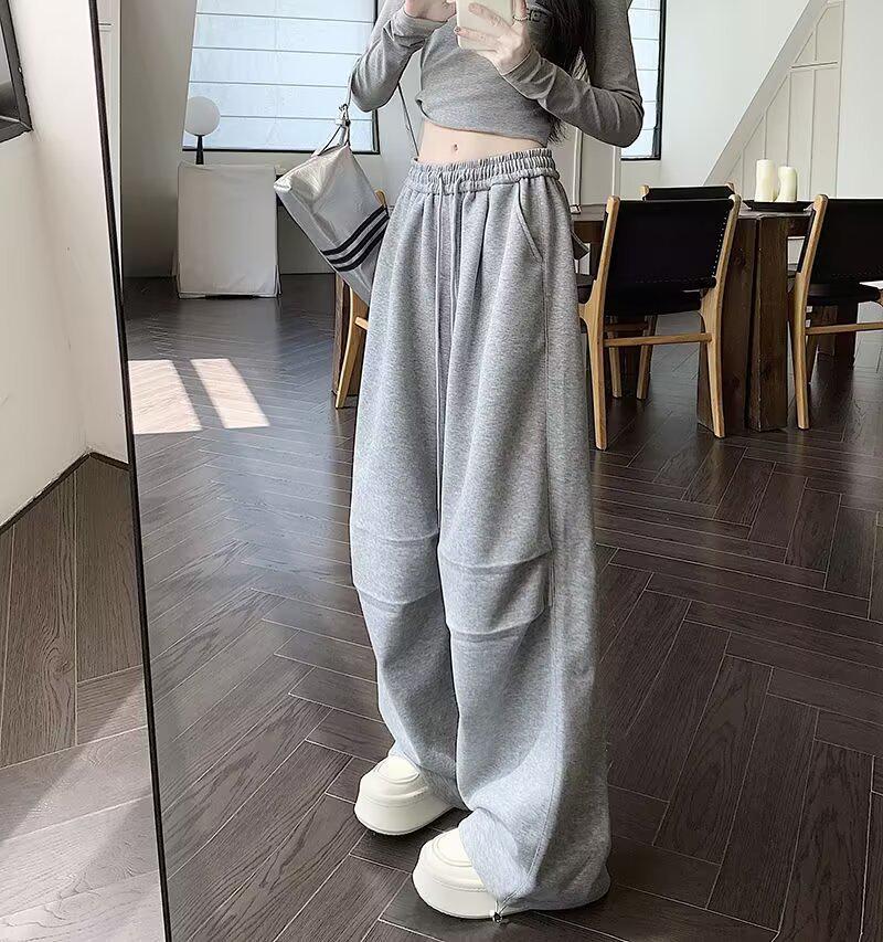 Elegantní kalhoty se širokými nohavicemi z ledového hedvábí s čínskou kaligrafií - Dámské letní ležérní splývavé