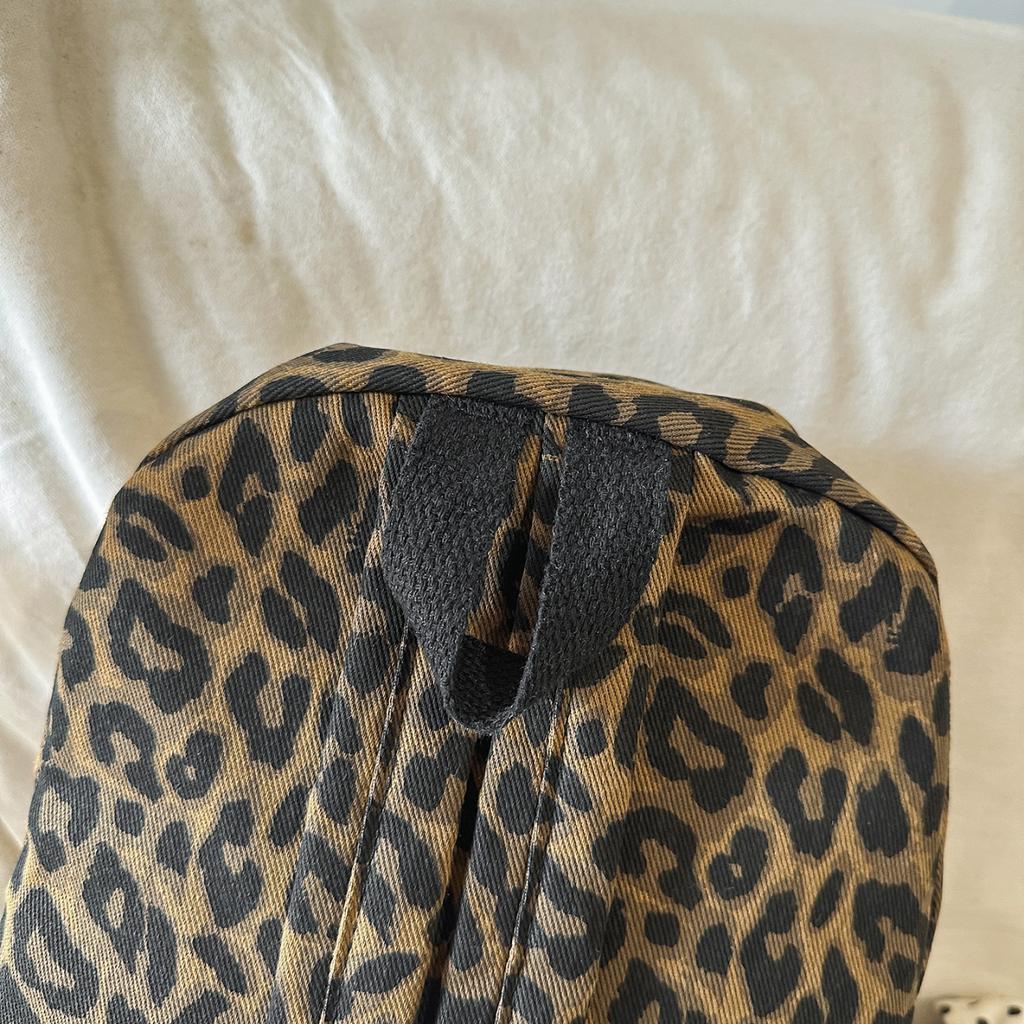 Leopard Print Backpack Casual Daily Use Trendy Street Style Lightweight Backpack for Women with Tassel Detail for School Travel and Everyday Outings