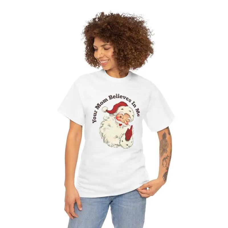 Funny Christmas Heavy Cotton T Shirt Your Mom Believes In Me Holiday Humor Festive Family Appar