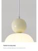 Cream Style Pumpkin Pendant Light: Modern Minimalist Bedside Lamp for Master Bedroom, Bar Counter, or Foyer with Single Head Cord Suspension.