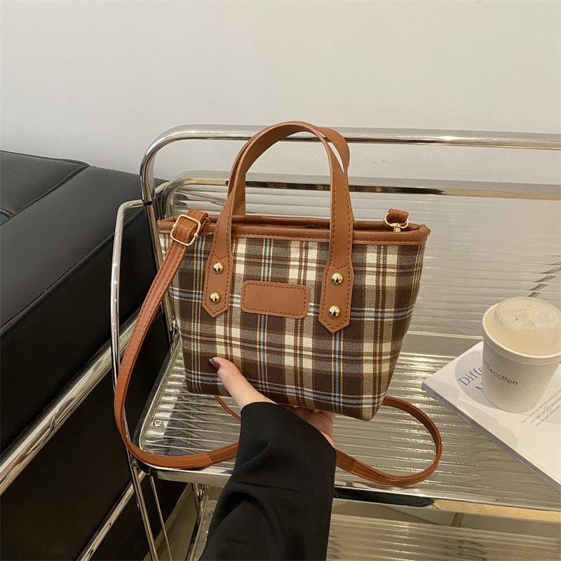 Light luxury plaid portable bucket bag women's classic niche design foreign-style texture shoulder messenger bag