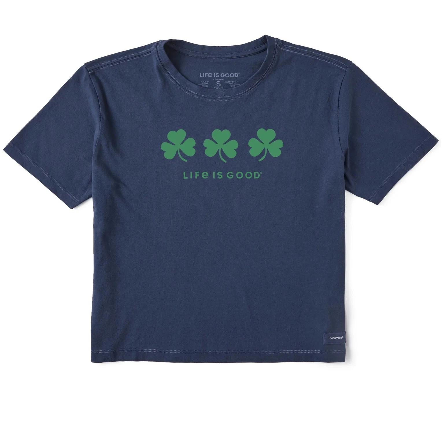 

Life is Good Women s Three Shamrocks Short Sleeve Crusher Boxy Tee, Darkest Blue M