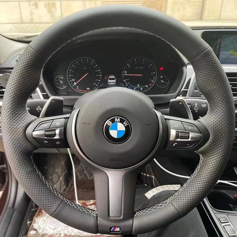 Hand-stitched black leather car steering wheel
