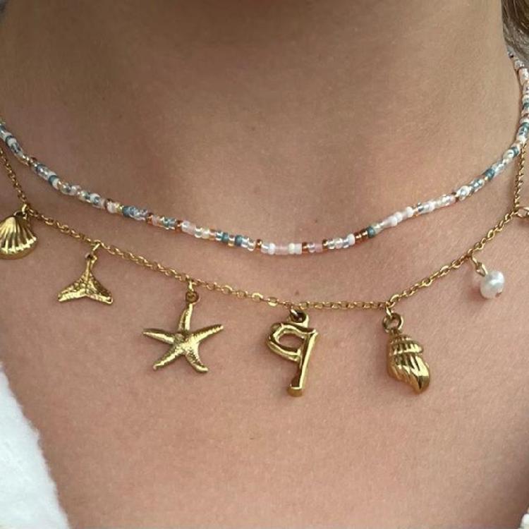 Ocean Theme Gold Charm Necklace with Initial Shells Letter Pendant Suitable for Surfer Girls and Beach Enthusiasts