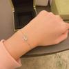 Exquisite Gold-Plated Copper Bracelet with Diamond-Studded Three-Leaf Clover Design