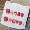 Whimsical Strawberry Cat Eye Press-On Nails for Kids: Handmade Cartoon Nail Art Stickers for Girls Ages 3-12.