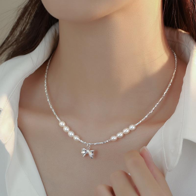 

Bow pendantnatural freshwater pearl necklacewomen s S925 silver broken silver collarbone chainspring and summer high-end neck chain.