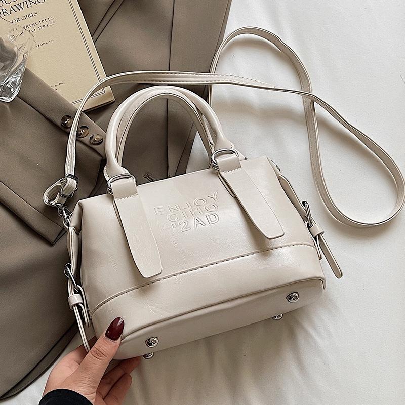 Korean Version of the New High-end College Temperament Portable Pillow Bag Women's Leisure Commuting Versatile Messenger Boston Bag