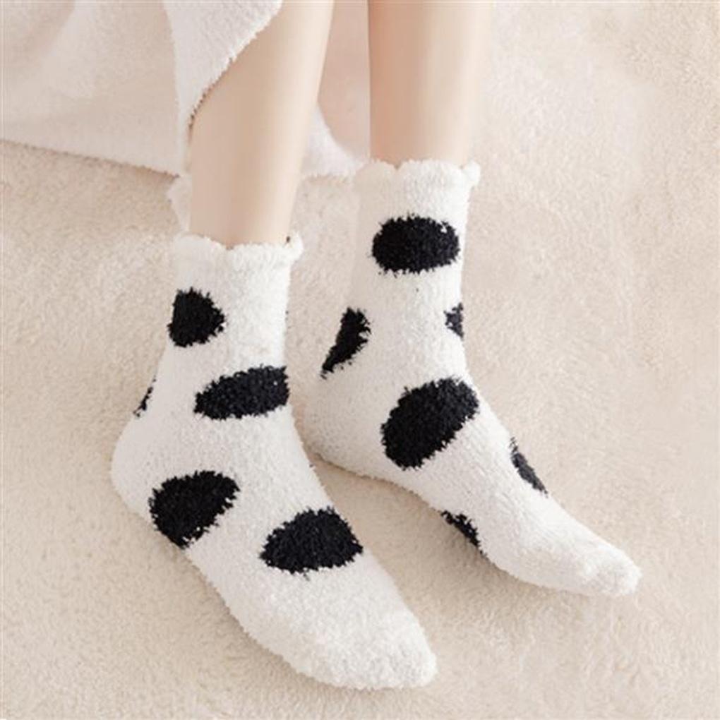 

Winter socks for a good night s sleep, with a warm, polka-dotted sleeping bag.