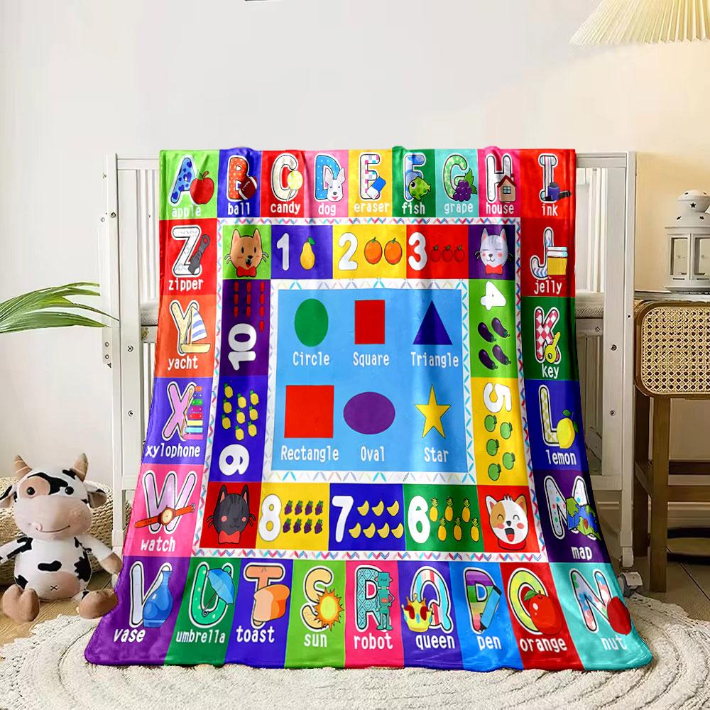 The pattern consists of letters, numbers, shapes, and corresponding images. for all seasons blanket lunch break throw gift