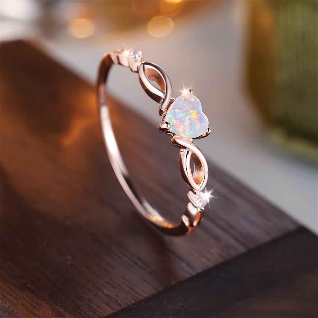 Bague couleur argent incrustée d'opale brillante en forme de cœur argentée ou rose dorée. Choisissez la couleur que vous préférez. Cadeau de Saint-Valentin de haute qualité pour femme.