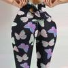Damskie legginsy do jogi z wysokim stanem: Elastyczna, pochłaniająca pot, z nadrukiem cyfrowym, z detalami w postaci kokardki