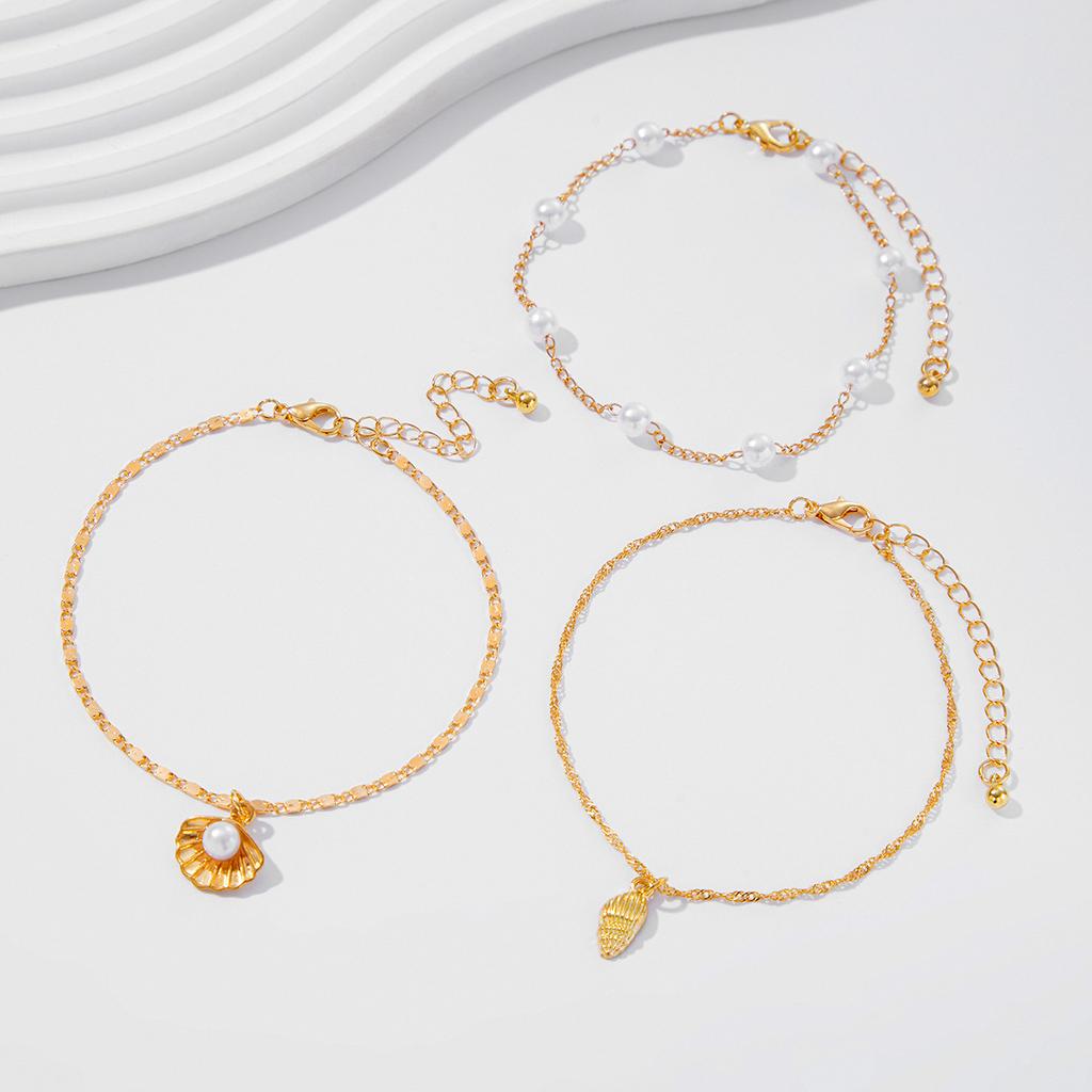 Simple thin chain stacked with imitation pearl foot jewelry, ocean vacation style starfish conch anklet women