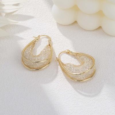 Boucles d'oreilles en or à mailles creuses transfrontalières, boucles d'oreilles de célébrités haut de gamme de luxe pour femmes, boucles d'oreilles uniques et élégantes