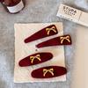 Red Velvet Bow-shaped Golden-label Hairpin As A New Year Hair Accessory for The Side of A Young Girl's Hair
