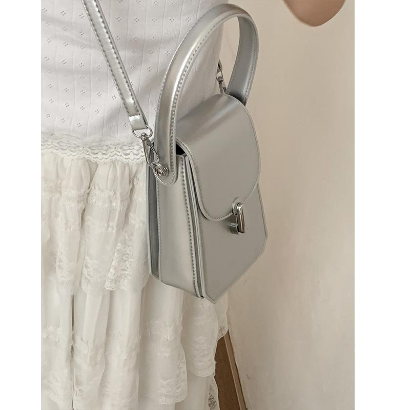 

Korean version of fashion handheld women s small bag mobile phone bag 2025 new summer small square bag simple shoulder crossbody bag серебряный
