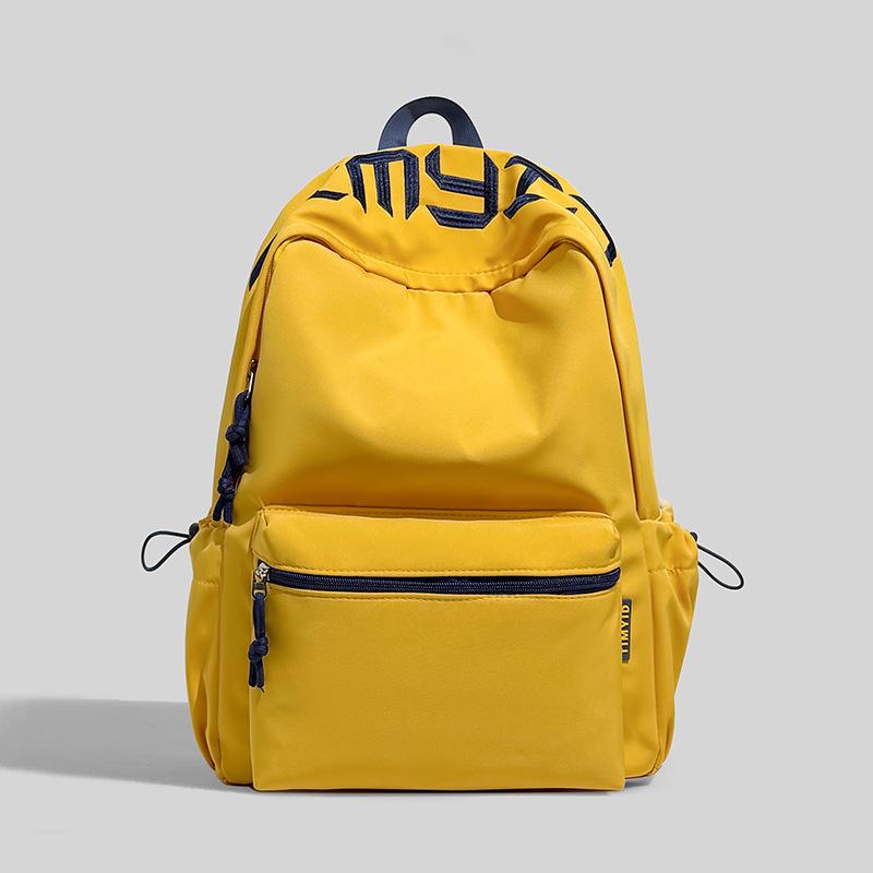 Schoolbag Japanese simple and versatile large-capacity solid color campus schoolbag 1011 summer new light commuter student backpack