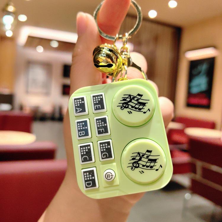 Leuchtender Mini-DJ-Mixer Schlüsselanhänger: Cartoon Musik-Spielkonsolen-Anhänger