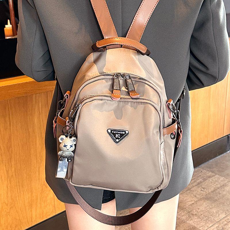 

2025 New Travel Lightweight Good-looking Niche Backpack Women Waterproof Oxford Cloth Small Backpack High-Grade Schoolbag Light brown
