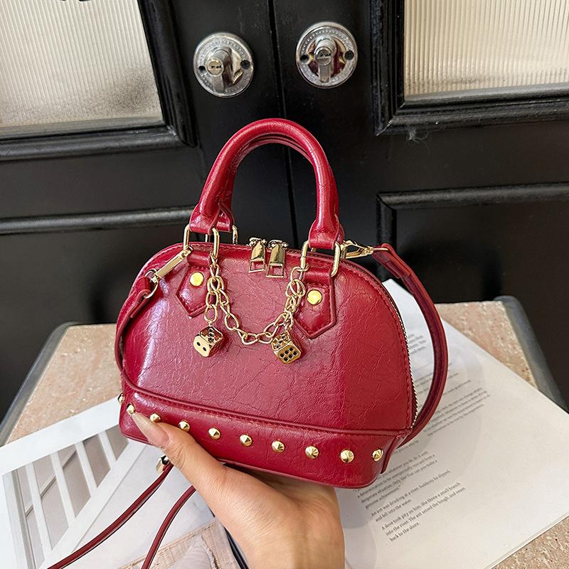 

Ins Internet celebrity shell bag 2025 new Korean version fashion rivet personalized shoulder bag women s portable messenger bag tide чорний