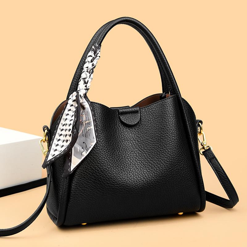 This Bucket Bag Is A Simple and Fashionable Urban Design with A Lychee Pattern and A Silk Scarf. It Is A Hand-held Shoulder Bag