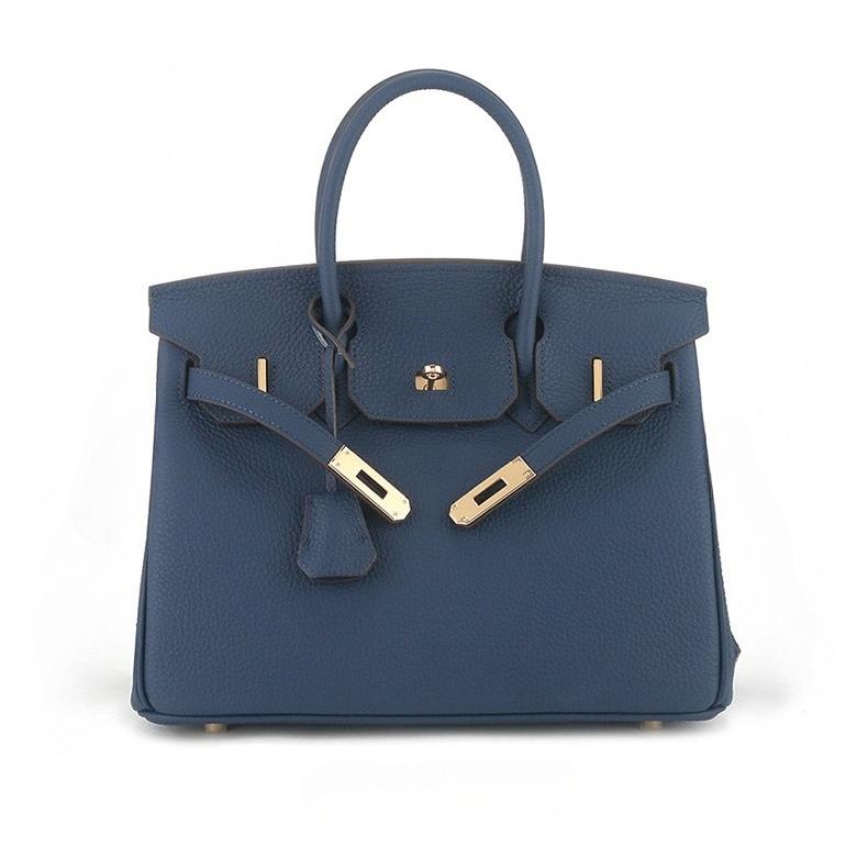 

Перший шар togo коров яча шкіра великої місткості шкіряна личі-візерунок жіноча модна застібка ручна сумка 35x19x26cm королівський синій колір