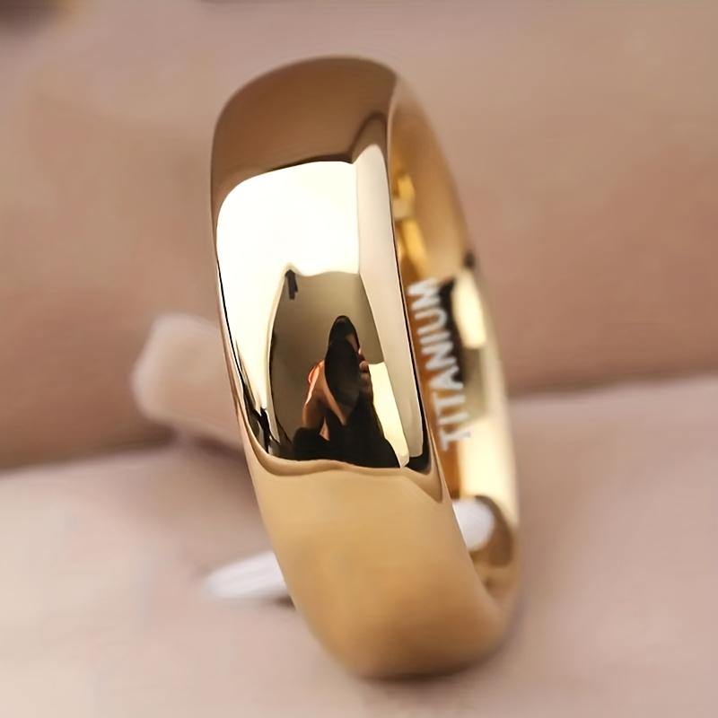 Ring in a Golden Gloss End, Featuring a Modern Minimalist Design Suitable for Weddings And Everyday Use. Showcasing a Stylish Polished Surface
