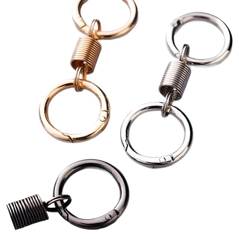 Creative Metal Double Loop Keychain with Pendant – Stylish Spring Ring Design