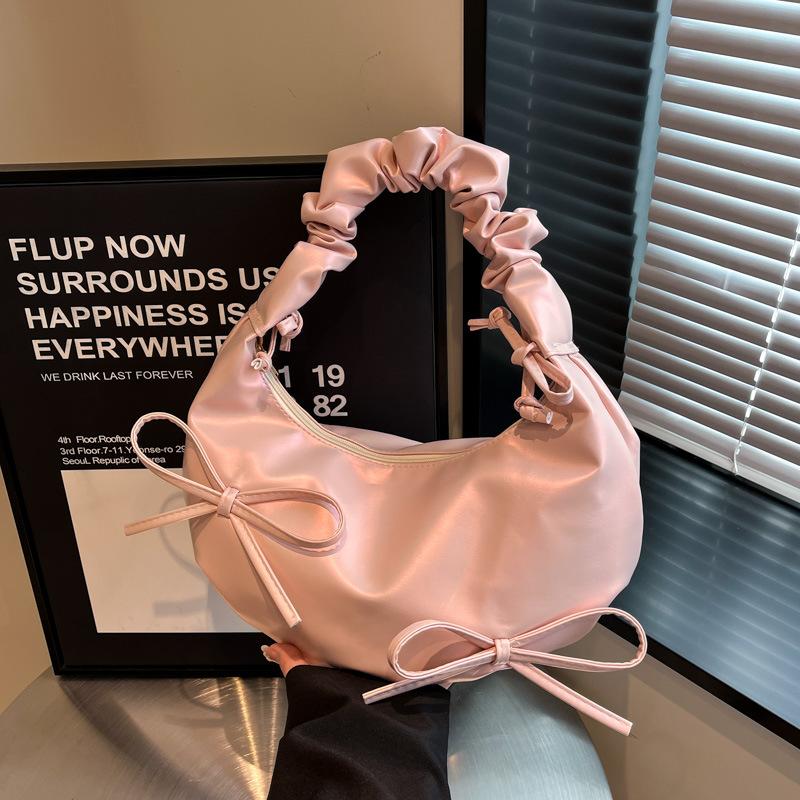 

Cloud bag women s niche design pleated shoulder strap bow shoulder bag 2025 new high-end textured underarm bag рожевий