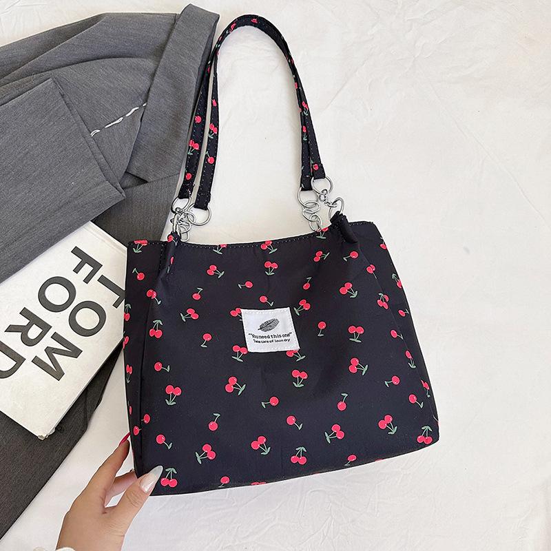 Large capacity niche design shoulder bag, new tote bag, portable women's bag, student shopping bag.